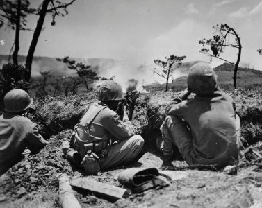 A Marine sniper and his spotter on Okinawa.