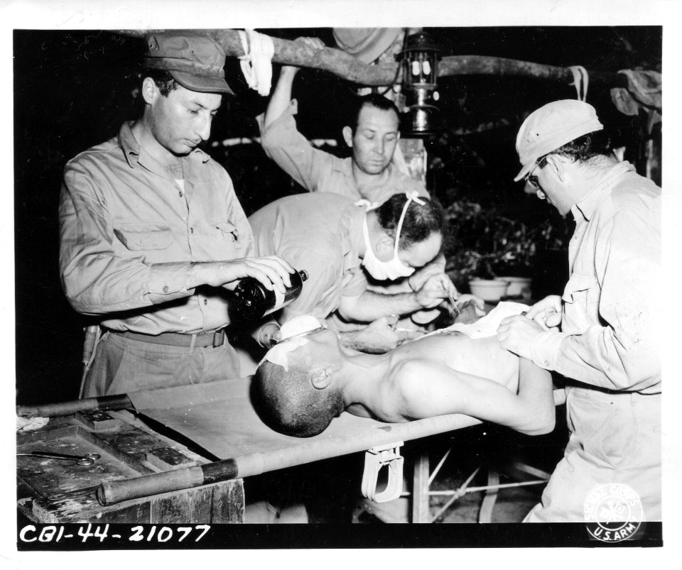 SC 190513 - 1st Lt. Bernard Golubuff administering open dr…