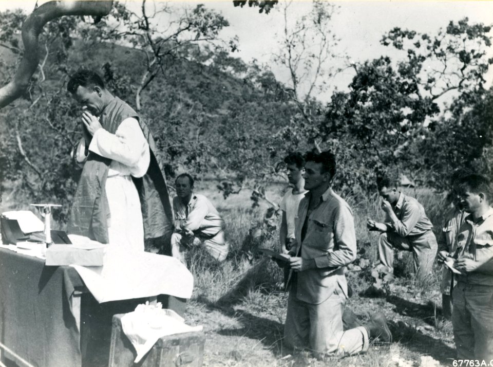 Men of the 38th Bomb Group attend a Catholic mass held on …