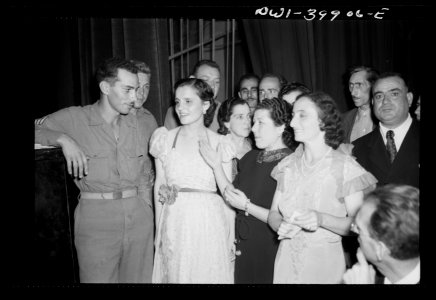 Allied soldiers and local girls at concert given by the Pa…