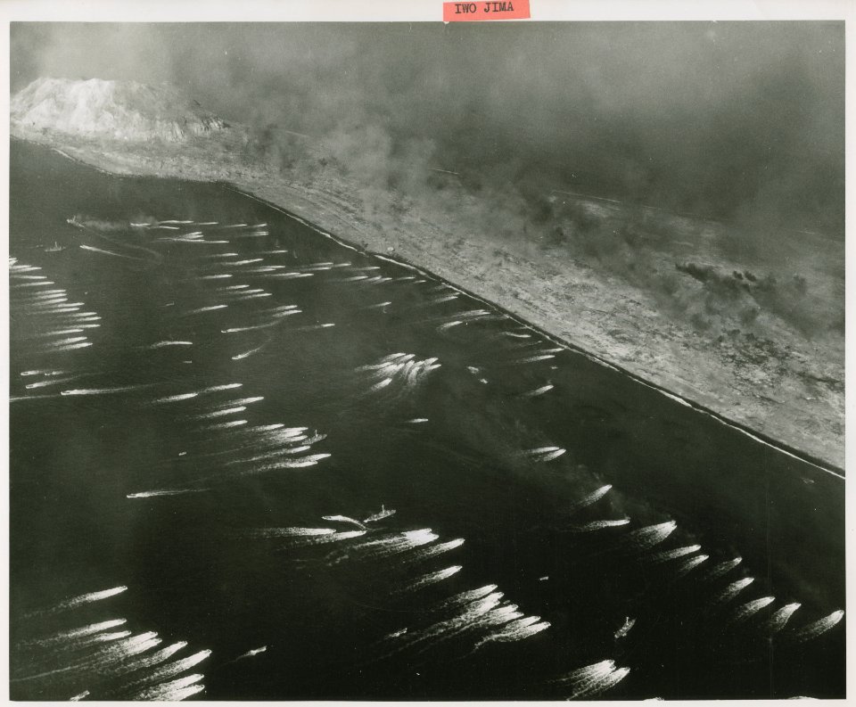Aerial photograph of the initial landings on Iwo Jima, Feb…