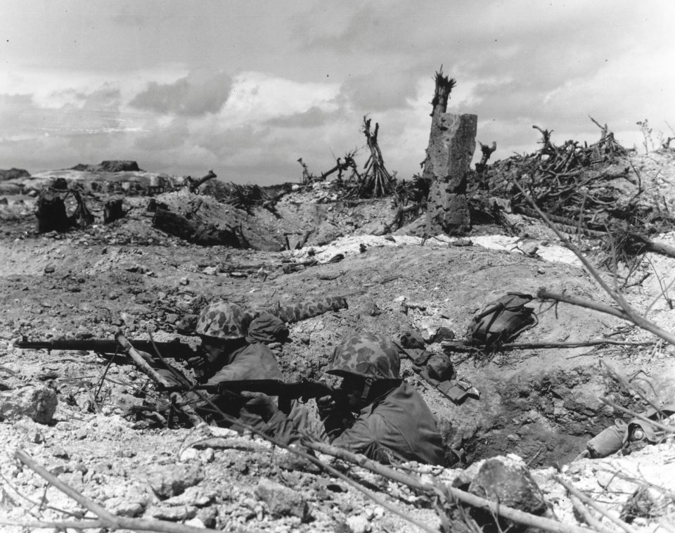 Pvt. Robert K. Marshall and Cpl. Allen L. Griffin aim out …
