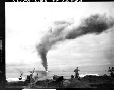 SC 190563 - Jap fuel dump at Aitape, ablaze from direct hi…