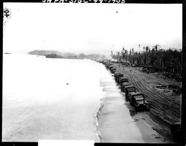 SC 190554-S - Trucks lined up on beach at Hollandia, New G…