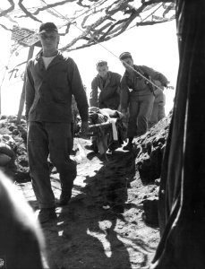 A wounded Marine is brought to the Fourth Division evacuat… photo