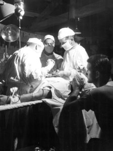 Navy doctors operate to remove shrapnel from the abdomen o… photo