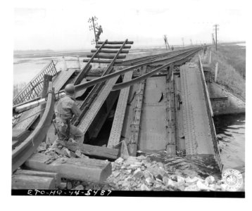 SC 190616 - Closeup of a blown-up railway bridge somewhere…