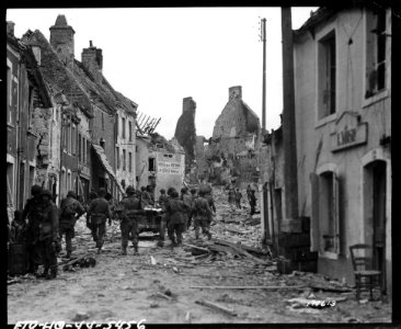 SC 190613 - American paratroopers move up to the front thr… photo