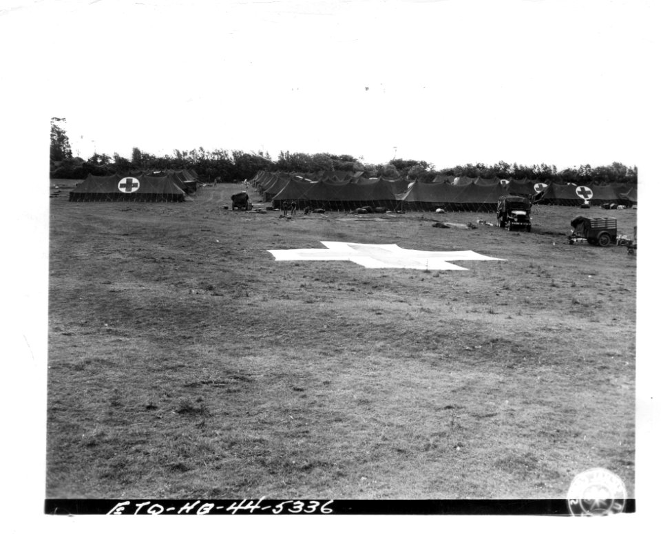 SC 190599 - Large red crosses mark the ground and tents be…