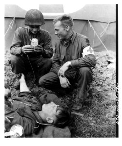 SC 190593 - U.S. medics giving blood plasma to a wounded G…