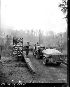 SC 411793 - A jeep and a trailer pass a sign announcing th…