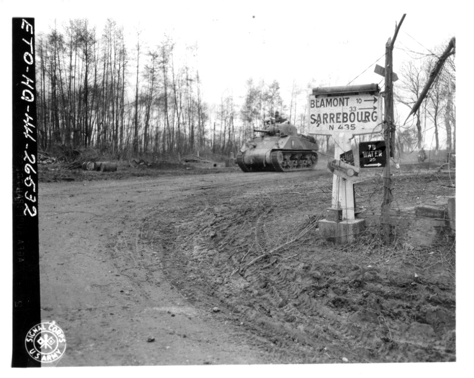 SC 411772 - M4 medium tank passing through St. Pole to tak…