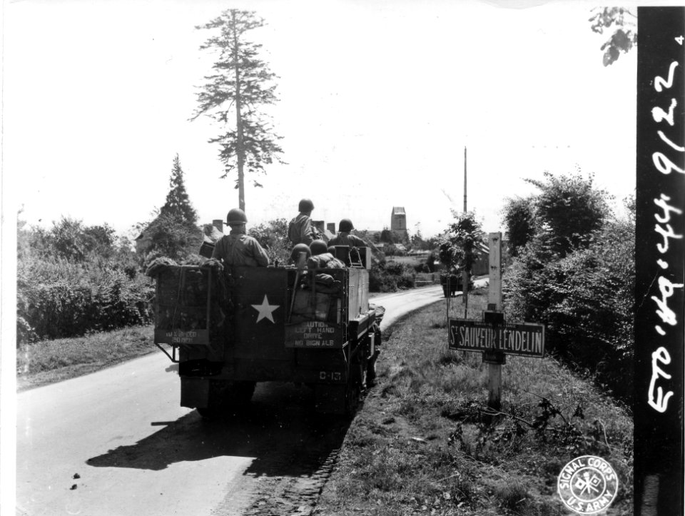 SC 411459 - Infantry travelling by half-track passes throu…