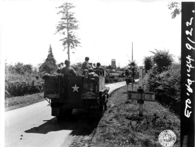 SC 411459 - Infantry travelling by half-track passes throu…