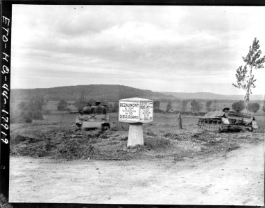 SC 411767 - A road sign is flanked on the right by a knock…