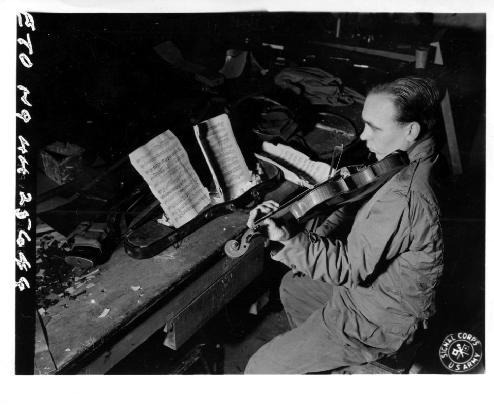 SC 196581 - T/5 Arvo O. Aho plays trombone in the 30th Inf…