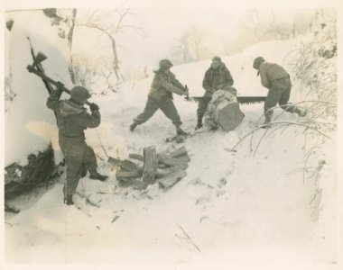 Men of Co. F, 133rd Regt., 34th Div. cutting up firewood f… photo