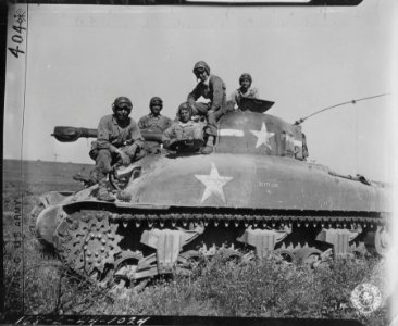 L to R: S/Sgt Reginald Rayno, tank commander, Tec 5 John K…