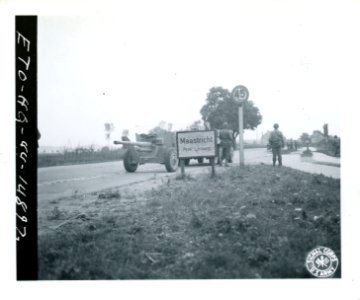 SC 194663 - American infantrymen pass the city limits sign…