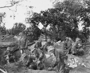Marines dig foxholes to prepare for their first night on S…