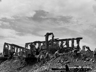 Marines of the First Division move in on the ruins of the … photo