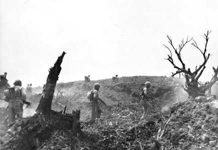Leathernecks of the 1st Marine Division advance over a hil… photo