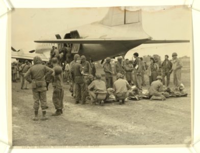At the Jap Yontan airfield on Okinawa, wounded Marines are…