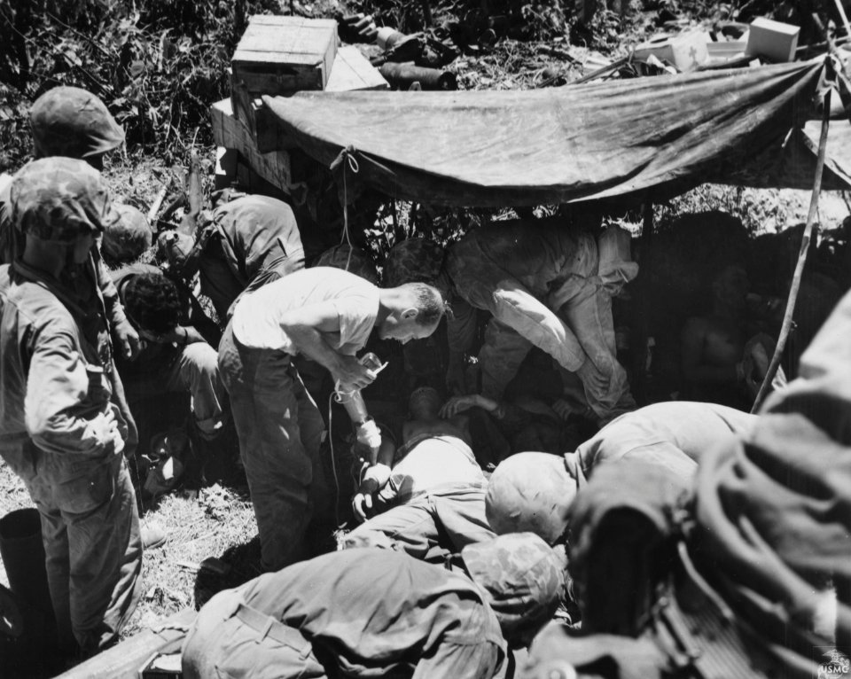 Wounded Marine being given plasma at a dressing station on…
