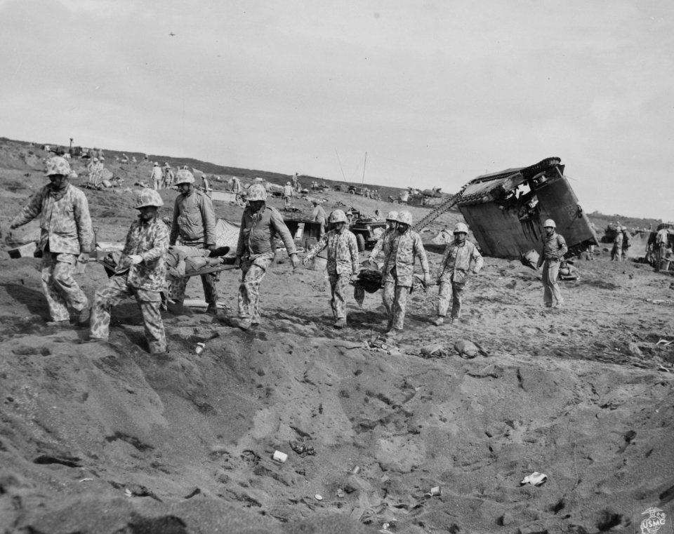 Dead 4th Division Marines are carried to the beach on Iwo …