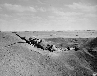 A dead Marine of the 4th Division on the beach at Iwo Jima…