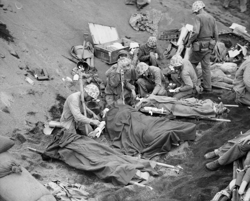 Navy doctors and corpsmen administer to wounded Marines at…
