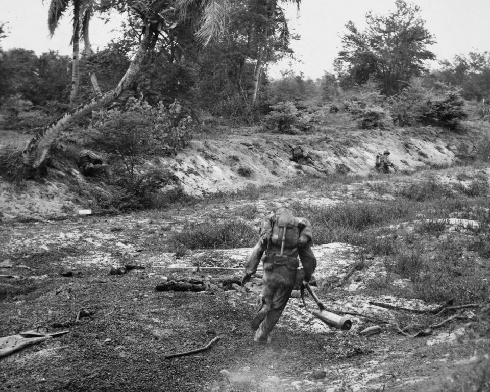 U.S. Marines, advancing on Japanese positions in northern …