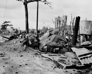 A Marine bazooka team in the ruins of Garapan, Saipan.