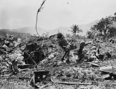 Marines, assaulting Japanese entrenched in front of them o…