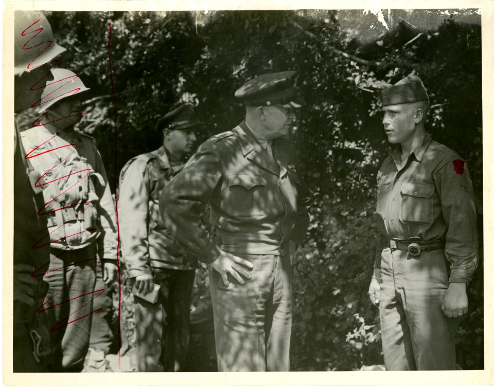 General Dwight D. Eisenhower is talking to Pvt. John Burns…