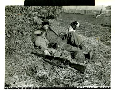 American soldier rests with an Italian child and dog, Acci… photo