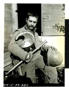 Capt. Frederick J. Saam, of Calumet, Mich., compares an It…