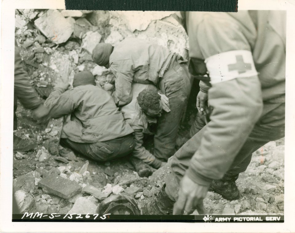 American soldier being pulled out from under debris after …