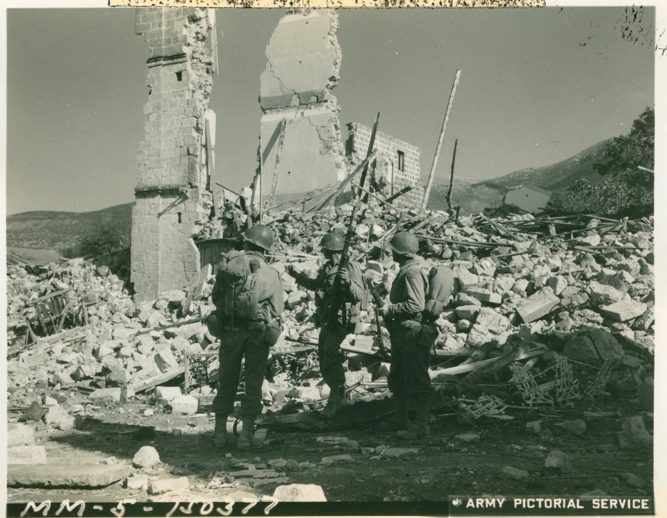 3rd Division GIs patrol the streets of Mignano, which was …