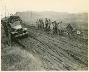 Men of the 39th Engineers standing by, after they got traf…