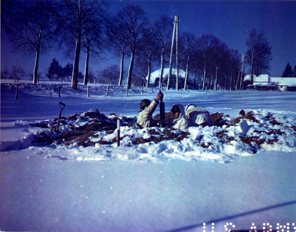 American soldiers man a dug-in mortar emplacement near St.…