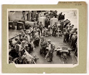 H Hour has arrived. American soldiers, hardened and ready,…