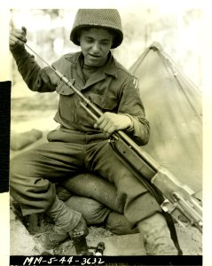 Pvt. Alton Knappenberger, 20, Spring Mount, Pa., cleaning … photo