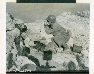 Lt. Michael J. Ciaglo, artillery observer at his post atop…
