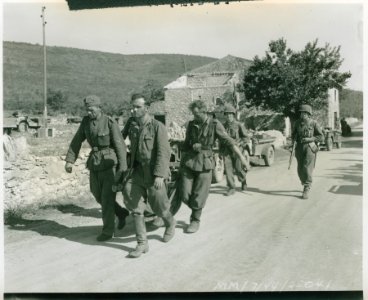 Wounded German being carried to a first aid station by his… photo