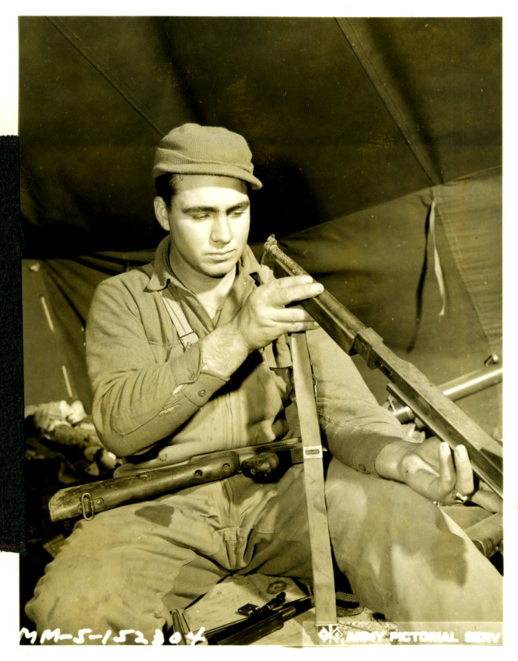 Sgt. Willie B. Slaughter inspects the 'Tommy' gun with whi…