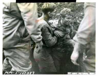 Mud-spattered Pvt. Sandile Jones of Manchester, Ky., escap…