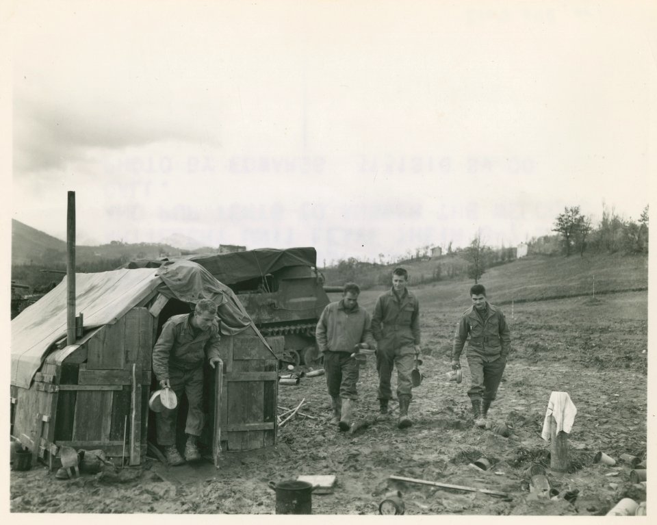 Chow! These Fifth Army men, members of a close-support 105…