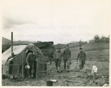 Chow! These Fifth Army men, members of a close-support 105…