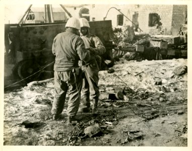 Two soldiers of the 2nd Infantry Div. performing maintenan…